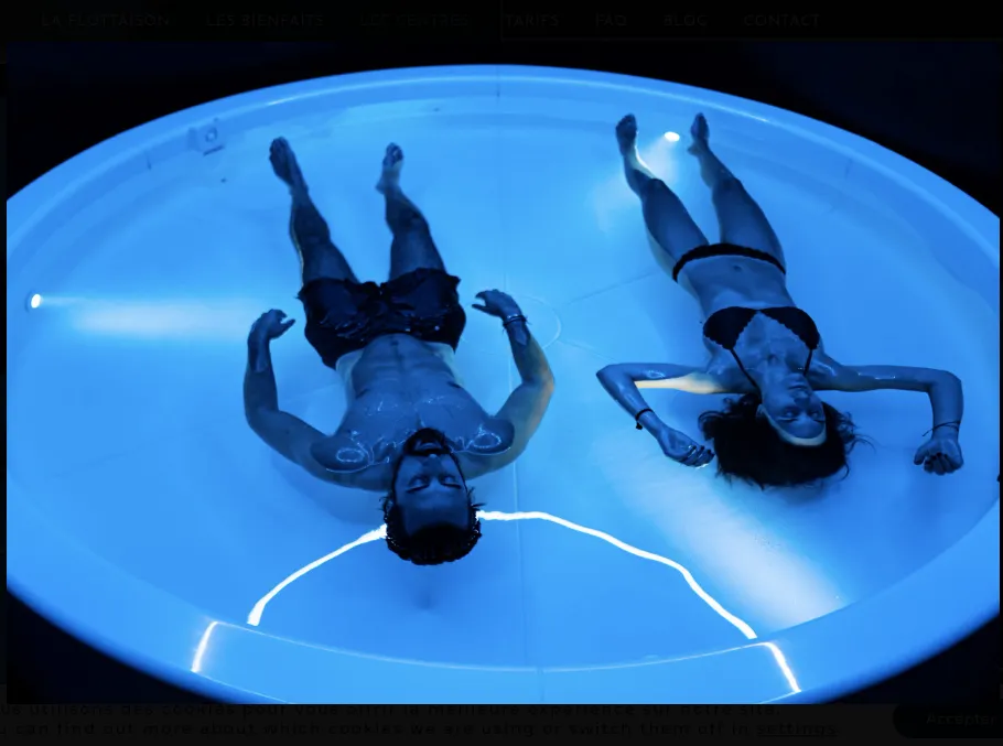 Two guests floating together in the couple float room