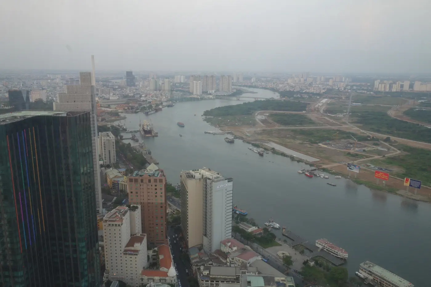 Hazy view over the Saigon River and Ho Chi Minh City from a high-rise in March