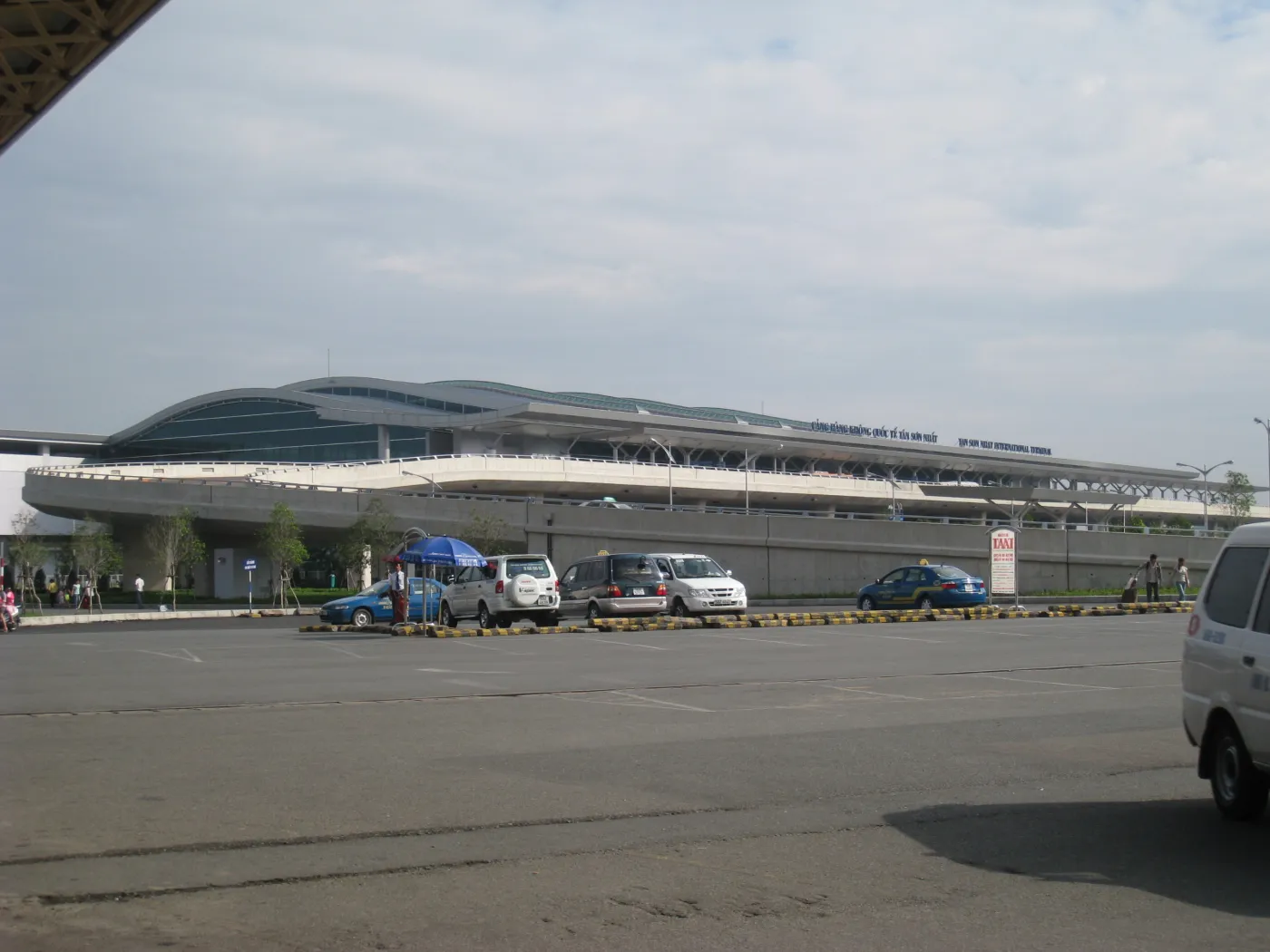 Front of the international terminal at Tan Son Nhat Airport, Ho Chi Minh City, with taxis parked outside