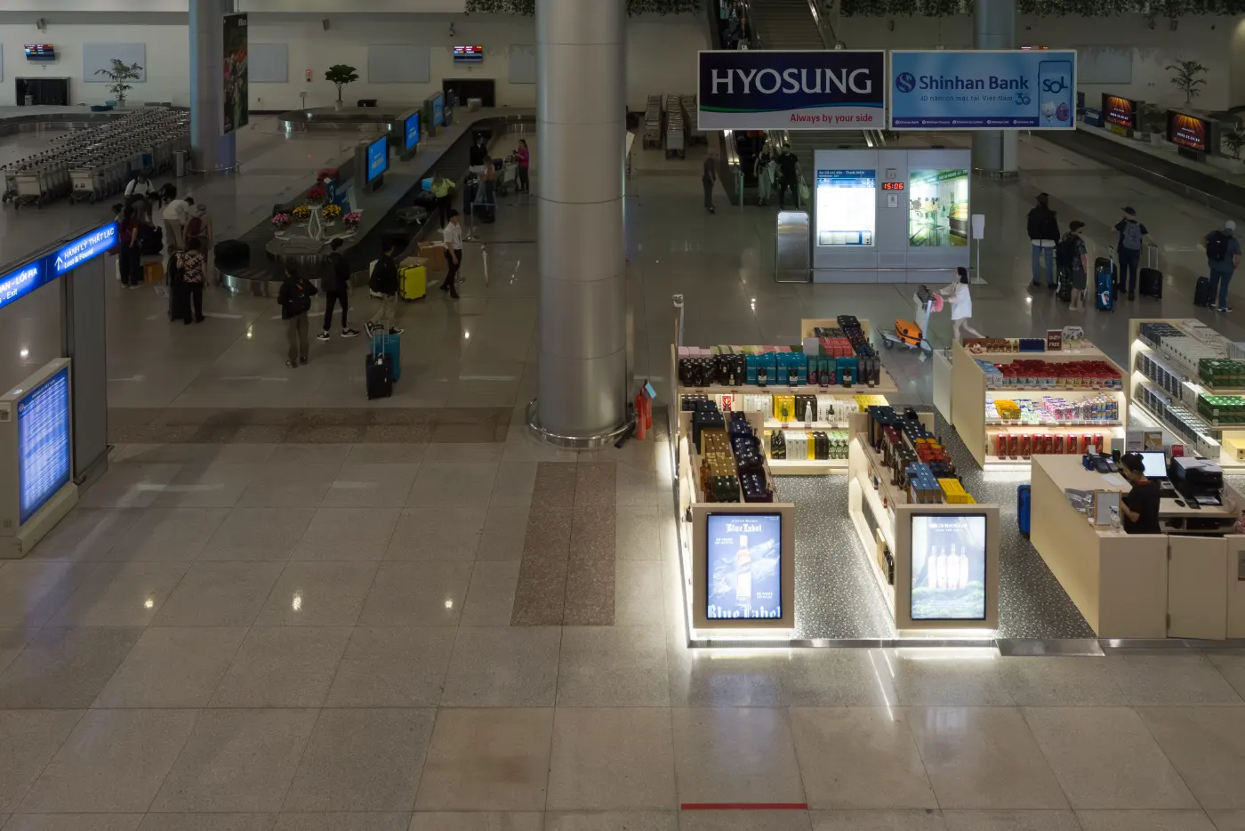 The international arrivals area at Tan Son Nhat International Airport, Ho Chi Minh City, with shops and a few travellers
