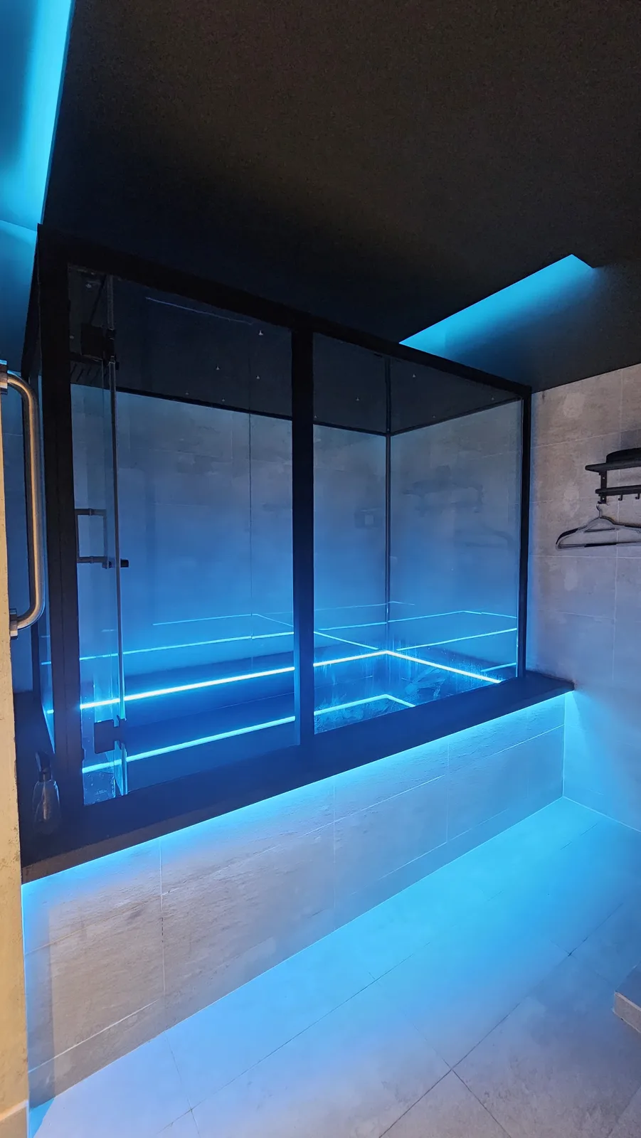 Glass float pool glowing with blue LED light
