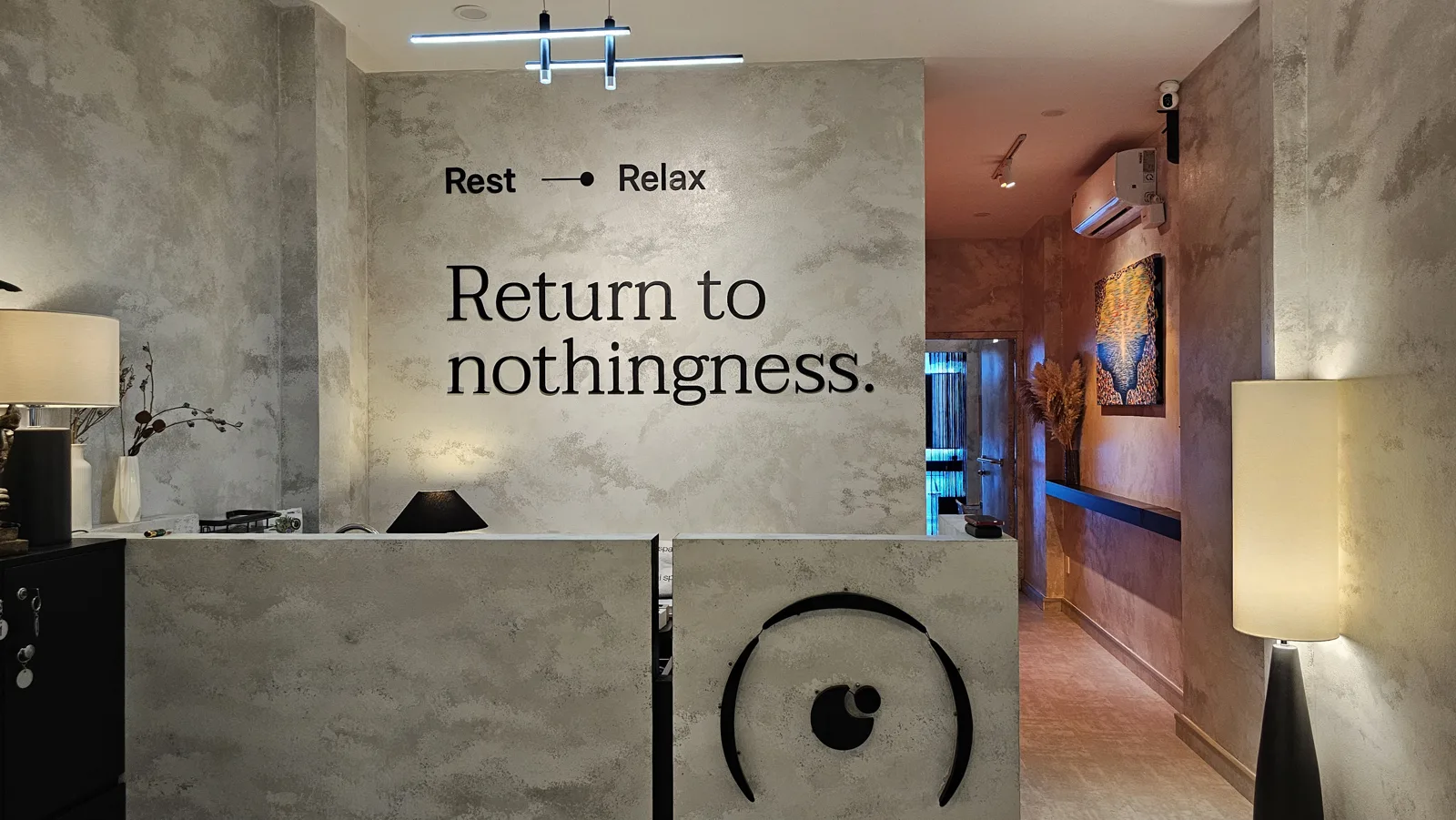 Ōmni Space reception wall reading Return to nothingness